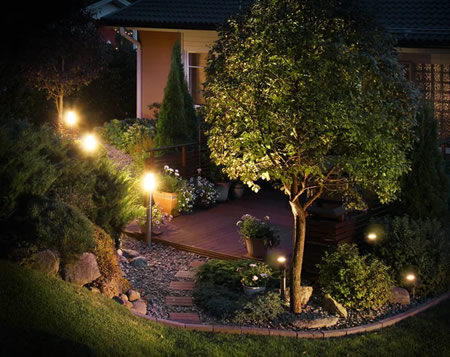 LED path and step lights along a Guadalupe River patio in New Braunfels, TX at dusk